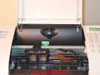 HP OfficeJet 630 interior open showing print carriage with color ink cartridge cradle and ribbon cable