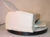 Epson Stylus Color 800 right-side view – paper loaded in rear feeder, output tray extended, printer on dark round base