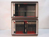 Philips VWI161/10 Vidiwall Processor — front view of both chassis stacked, top unit nearly empty with a few cards, bottom unit populated with multiple expansion cards and red handles