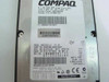Compaq 127889-001 drive label close-up showing 9.1GB 7200RPM Wide Ultra SCSI specs, Fujitsu MAE3091LC model, part number CA05348-B221DCCP, and manufacture date 1999-06