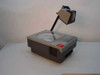 3M 905D Overhead Projector — right-side view showing ventilation grilles on base, projection arm folded to one side, red power button visible