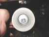 Sputtering target close-up – circular target in holder showing metallic deposition residue on target surface
