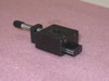 Newport 411-05S miniature linear stage — side view showing ball-bearing rail rods, platform body, and micrometer screw shaft