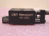 Newport 411-05S miniature linear stage — close-up front face showing Newport logo, model number, precision ground rail rods, and micrometer knob