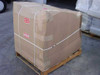 Lexmark Optra printer lot on wooden pallet, fully boxed with cardboard and strapping, Do Not Stack and Fragile labels — outdoor view