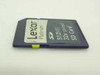 Lexar Platinum SD512-32 512MB 32x Speed SD Card – angled side view showing write-protect lock switch