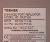 Toshiba PA2718U Enhanced Port Replicator – bottom label showing model number, DC 15V 1.4A input/output, Made in Japan