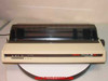 Okidata Microline 193 Plus GE8251P dot matrix printer — front view, cream housing with clear paper guide cover