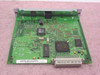 HP J4106A JetDirect 400N print server card — PCB reverse side showing main controller IC, secondary chips, crystal oscillator, and edge connector