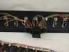 Detail view of rackmount panel showing DB25 connector ports and multicolor wiring with one large connector adapter attached