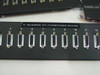 Rackmount patch panel labeled T-Screen to Computer Room with numbered DB25 ports 4 through 12 visible