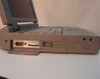Toshiba Satellite Pro 435CDS right side — port door open showing DB-9 serial and DB-25 parallel ports, 1.44MB floppy drive bay