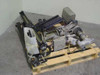 Assorted vintage industrial camera accessories lot on wood pallet — pan/tilt head, linear rails, drive motors, and brackets visible from above