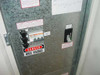 MGE EPS 2000 UPS interior door panel — circuit breakers labeled Q45, Q1 disconnect switch, and Danger High Voltage warning sticker