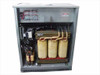 MGE EPS 2000 UPS interior — three large three-phase transformer cores (yellow/tan), power bus bars, capacitor banks, and control wiring