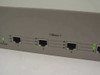 D-Link DES-2205 – front panel close-up showing power LED illuminated green and three 10Base-T RJ-45 ports with active link LEDs