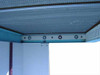 Micro Air MAA-40 interior ceiling view showing HEPA filter mesh face and front mounting bar with four circular lamp socket ports