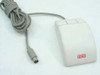 Logitech CA-93-6MD three-button PS/2 mouse — top view showing two buttons, beige body with Altos logo, and coiled PS/2 cable