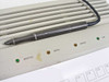 HP 9111A front-panel detail — tethered stylus pen resting across DIGITIZE, MENU, ERROR, and LINE LED status indicators; amber and green LEDs visible