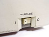 HP 9111A left side panel — AC LINE rocker power switch in I/O position with yellowing typical of age