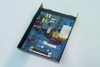 DMP Model 984-D Communication Module – interior PCB view showing blue circuit board with components, terminal blocks, and DB25 connector