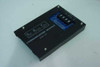 Digital Monitoring Products DMP Model 984 Communication Module – top view showing black enclosure and DMP logo plate with blue PCB visible