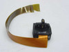 Panasonic KX-P1124 dot matrix printhead close-up showing label marked B1020F with looped gold flat ribbon cable