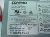 Compaq PS-6201-6C3 power supply label showing part number 201828-001, input/output specs, and serial number