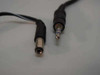 Close-up of included audio cable connectors: barrel jack (left) and 3.5mm stereo plug (right)