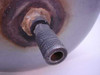 Close-up of fill port fitting on end of Campbell Hausfeld Air Carry Tank showing oxidation around fitting base