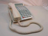 NEC DTP-16D-1 Dterm Series E white office telephone — front three-quarter view showing handset, curly cord, LCD display, and programmable key panel