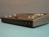 Side and rear view of Tele Images desktop podium showing multiple rotary volume knobs on top surface, red switch, and two 3.5mm audio jacks on the side panel