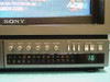 Sony CVM-1900 front panel close-up — V Hold, Sharp, Hue, Color, Bright, Picture controls, channel presets 2–13, TV/VTR/Line selector, Volume knob, Power button, and channel 16 display