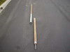 US Tucker tent upright pole set disassembled — male section and female section laid side by side on pavement showing two-piece construction