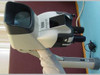 Vision Engineering Mantis stereo microscope on stand, right-side view showing viewing hood, focus knobs, and power cable