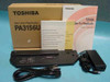 Toshiba PA3156U Slim Port Replicator in OEM box with AC adapter, power cable, and user manual laid out in front