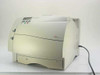Lexmark Optra S 1650 laser printer front left three-quarter view showing LCD control panel, paper tray, and power cord