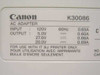 Canon BJC-7000 AC adapter rating label (K30086) — input 120V 60Hz, output 5.0V/27.6V/20.0V DC