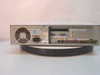 Compaq Presario 7222 desktop computer — rear panel showing power supply fan, AT keyboard port, serial and parallel ports, expansion card slots (ISA and PCI), audio jacks, and IEC power inlet