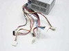 Dell HP-233SNF ATX power supply — close-up of cable harness showing ATX 20-pin main connector, Molex 4-pin, and auxiliary connectors