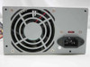 Dell HP-233SNF ATX power supply — rear panel showing 80mm cooling fan, IEC C14 AC inlet, and red voltage selector switch
