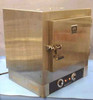 Blue M OV-185A stainless benchtop lab oven – front three-quarter view showing door latch handle and front control panel with two knobs and indicator lights