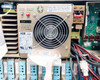 Interior view of ABB CEAG +27VDC power supply module with large cooling fan, ADJ controls, alarm LEDs, and wiring harness