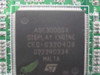 Close-up of ST ADE3000SX Display Engine main chip showing markings CEG-G320408 and STMicroelectronics ST logo