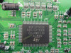 Close-up of ST ADE3700SX main controller IC on LCD display engine board, showing chip markings ACG-G319008 and GA2AW0330