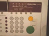 Ricoh OmniFax L46 control panel close-up showing numeric keypad, function icons, Darken/Normal/Halftone/Lighten/Standard/Detail/Fine/Memory/Copy controls, yellow Stop and green Start buttons