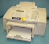 HP C2890A OfficeJet All-in-One front view showing control panel, LCD display, keypad, document feeder, and open paper output tray with sample print sheets