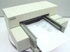 HP DeskJet 500C C2114A color inkjet printer – three-quarter front view with paper loaded in output tray