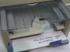 HP DeskJet 820Cse paper output tray close-up with a Windows XP Printer Test Page successfully printed and emerging
