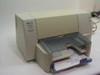 HP DeskJet 820Cse color inkjet printer front three-quarter view with paper tray open and Windows XP test page partially fed
